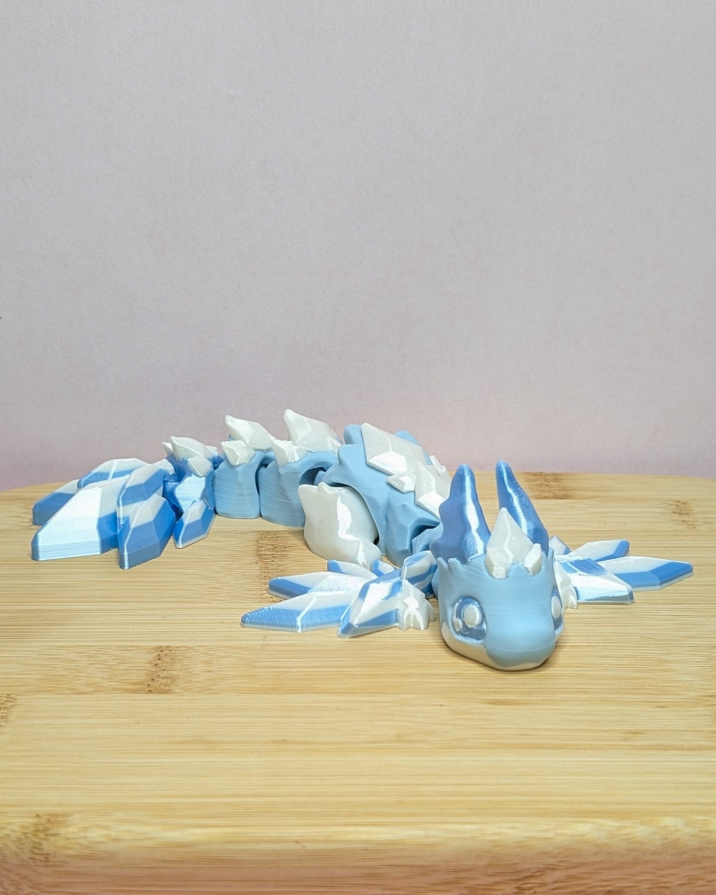 Frost Dragon – 3D printed icy blue frost dragon figurine, handmade in Geelong by Elevated Expressions