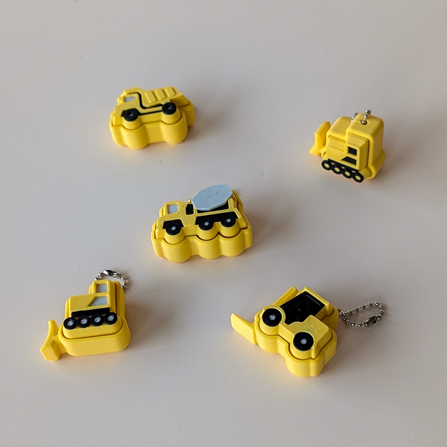 Cute construction clicker sensory toy β bulldozer and dump truck designs, satisfying desk fidget