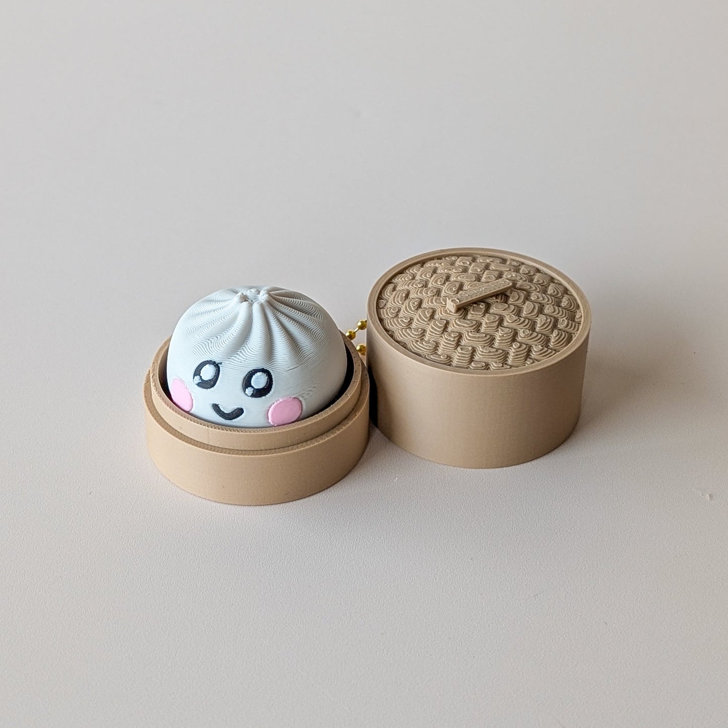 Dumpling Clicker fidget toy — clicky or silent switch, mystery face design