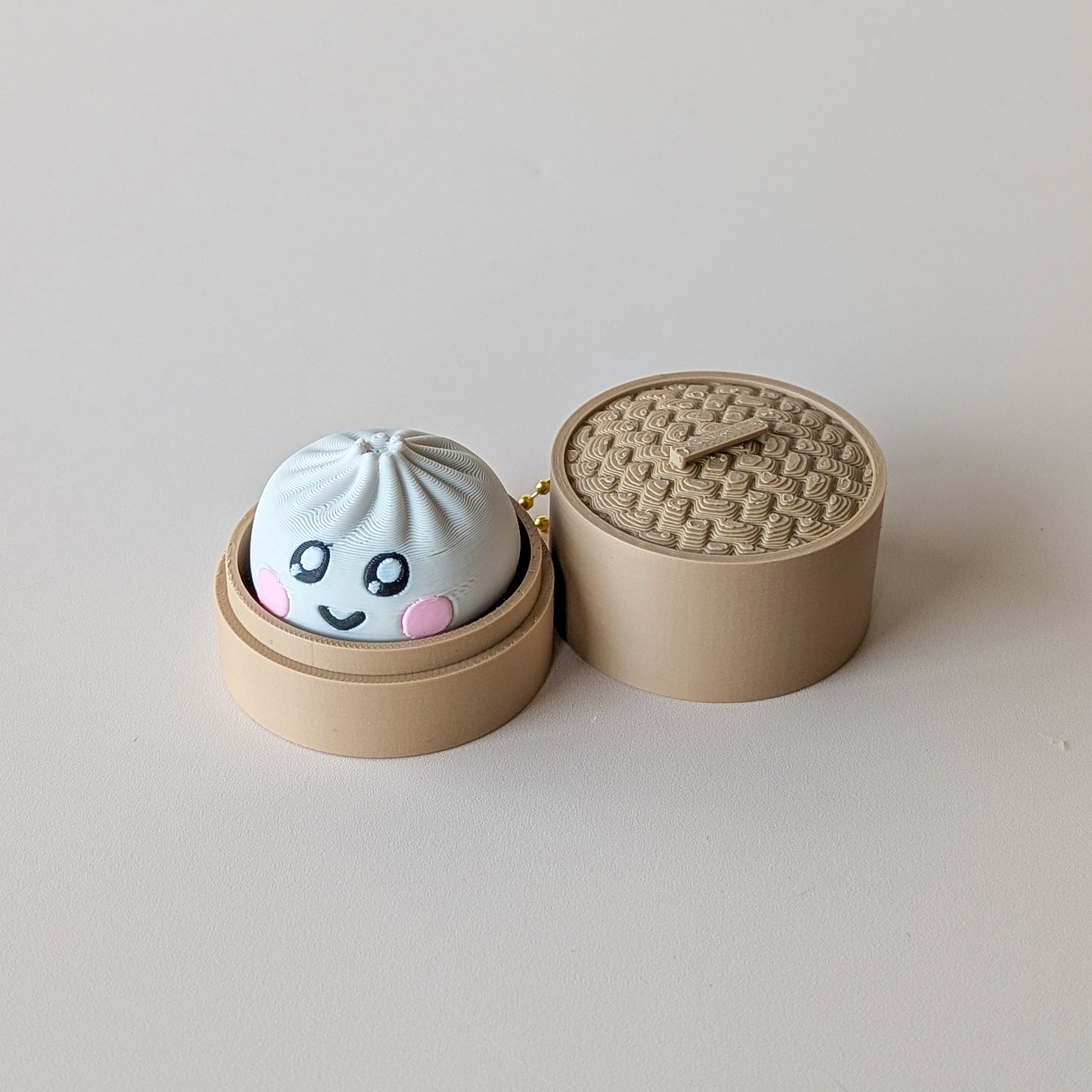 Dumpling Clicker fidget toy — clicky or silent switch, mystery face design