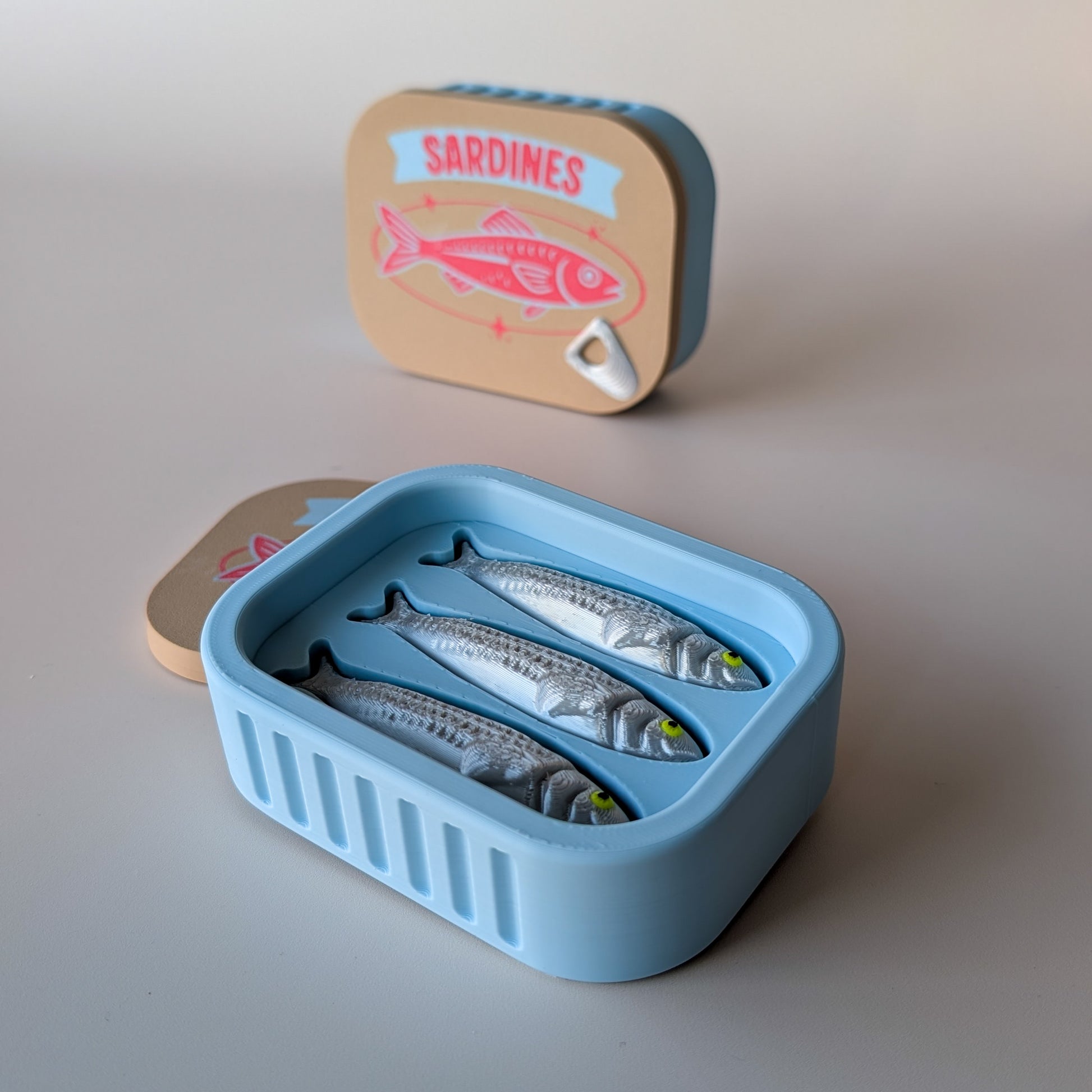 Sardine Tin Clicker Large — novelty fidget toy shaped like a sardine tin, made in Geelong by Elevated Expressions