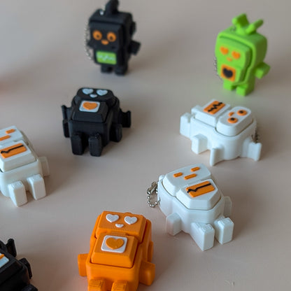Robot Clicker fidget toy in multiple colours — cute pocket-sized robot clicker by Elevated Expressions