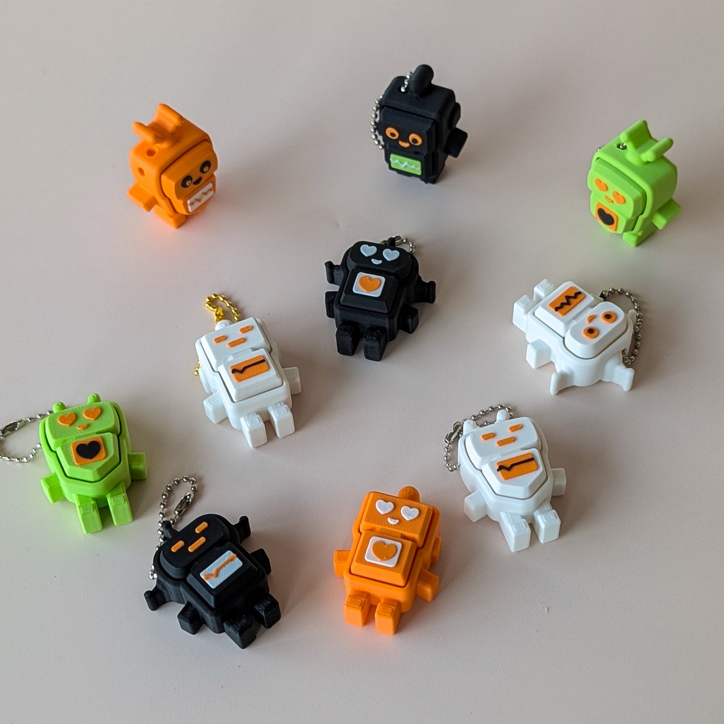Robot Clicker sensory fidget toy — clicky and silent switch options, available in Black, White, Orange and Green
