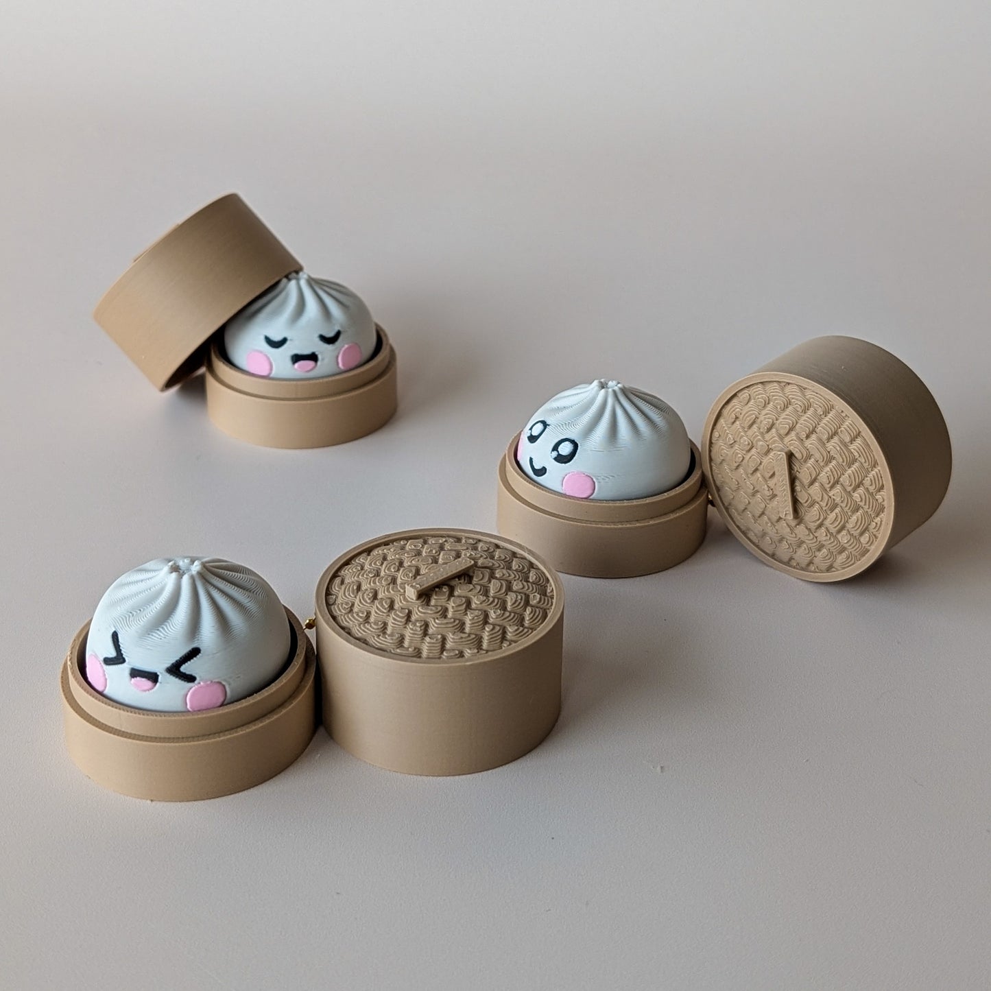 Dumpling Clicker pocket fidget toy — satisfying click, mystery face, available in clicky or silent